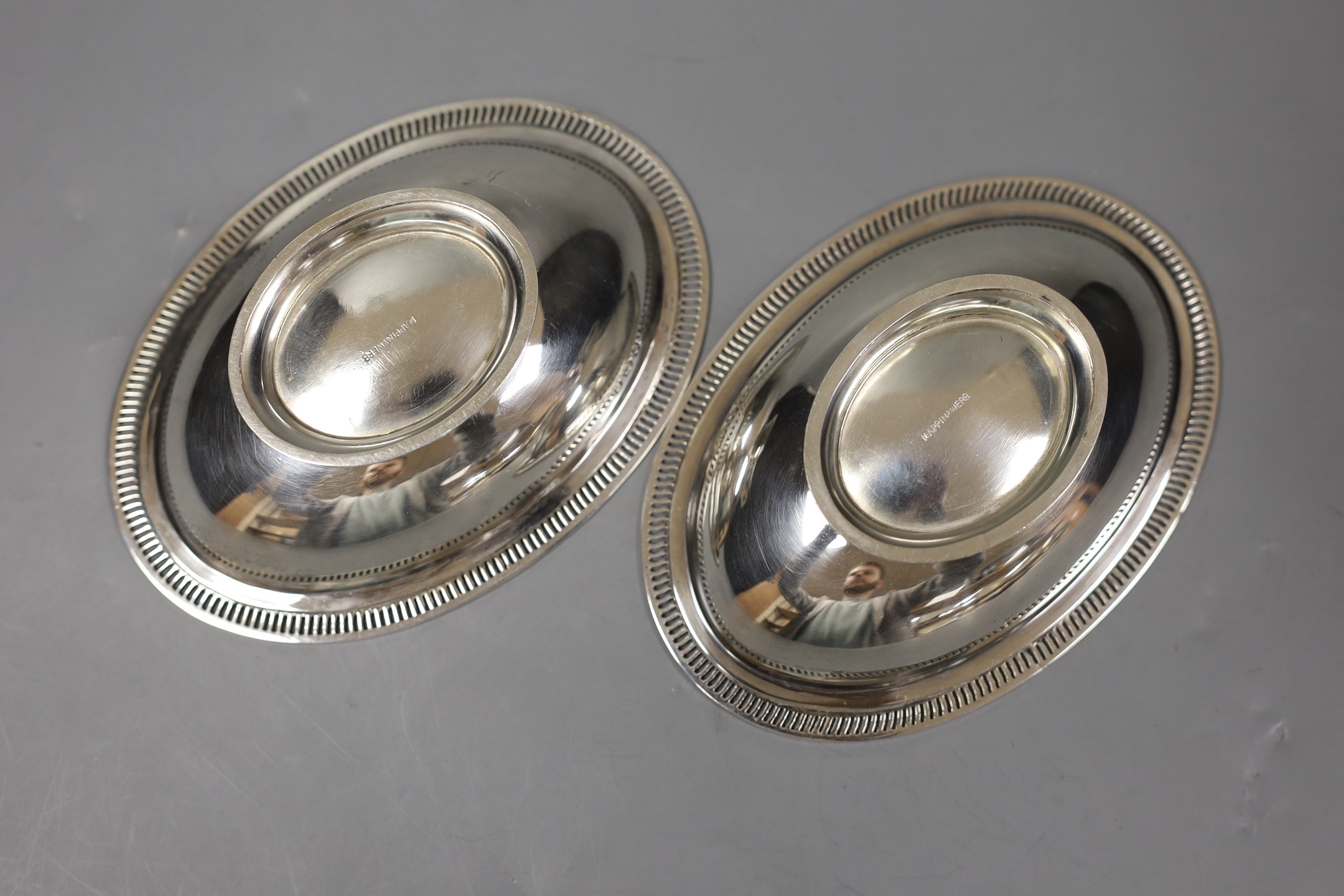 A pair of George V silver oval pedestal nut dishes, by Mappin & Webb, Birmingham, 1929, 12.7cm, 142 grams.